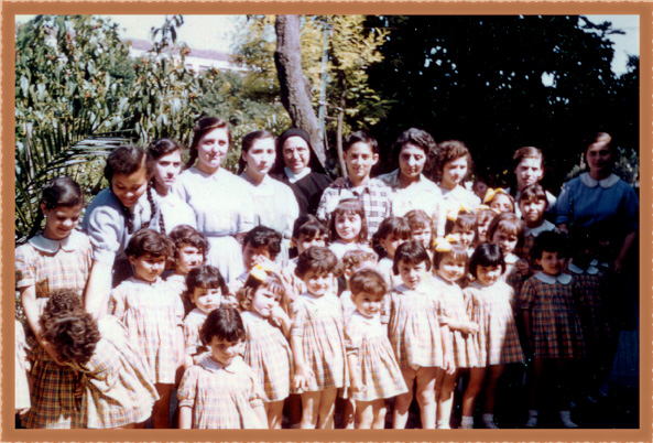 Don Dana (top row middle) with the orphans of La Piccola Casa di San Antonio in 1960